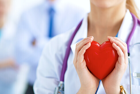 Doctor holding heart in her hands